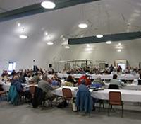 Large group of stakeholder listening to a presentation