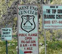 Two pictures,partially overlaid on one another. The background picture is a scenic view of the Arizona desert. A smaller foreground picture is that of signs providing shooting information.